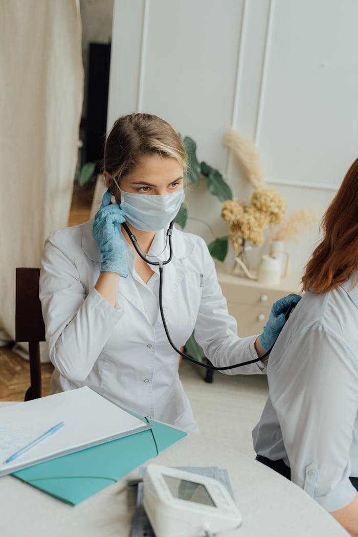 Doctor Checking the Back of a Patient